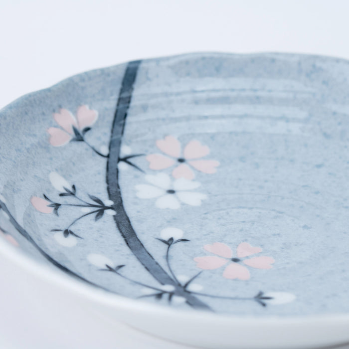 Authentic Japanese Mino ware ceramic plate with a delicate Sakura (cherry blossom) breeze motif.